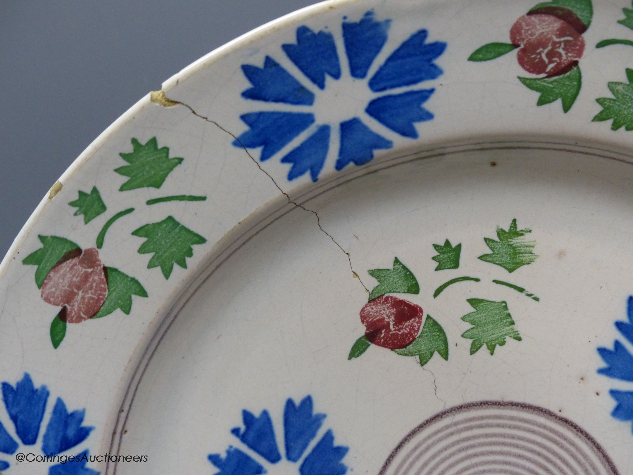 A pair of Continental polychrome faience chargers, late 19th century, height 33cm - one cracked